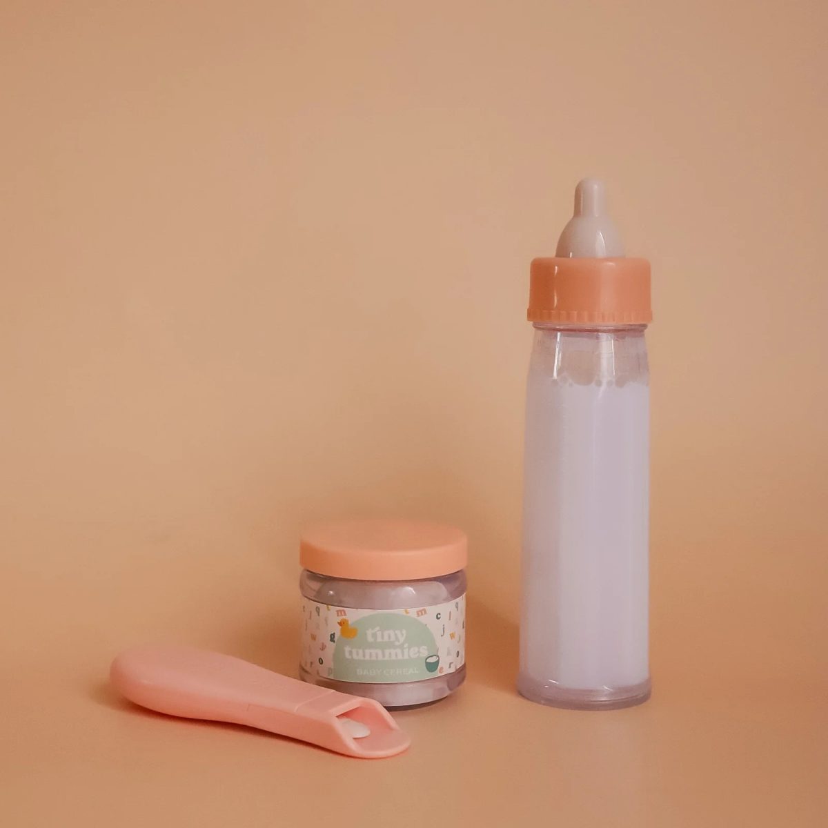 Tiny Harlow: magiczna butelka i słoiczek z łyżeczką do karmienia lalek Tiny Tummies - obrazek 1